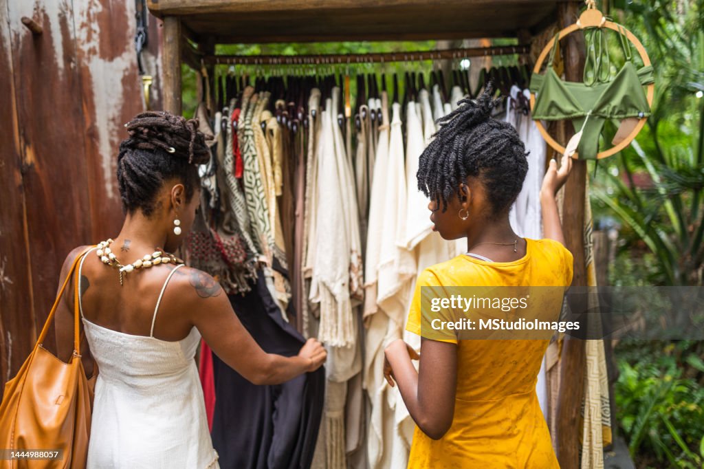 Mother and daughter choose wardrobe in the store