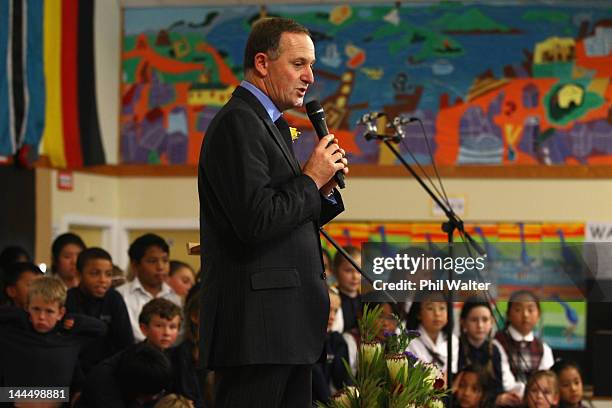 New Zealand Prime Minister John Key speaks to schoolchildren as he opens a new classroom block at the Westminister Christian School on May 15, 2012...