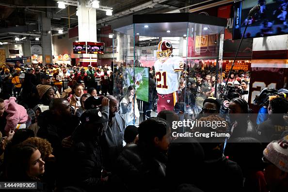 Washington Commanders fans attend an unveiling of a memorial for Sean ...