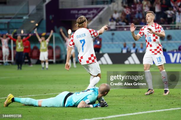 Lovro Majer of Croatia celebrates with teammates after scoring their team's fourth goal during the FIFA World Cup Qatar 2022 Group F match between...