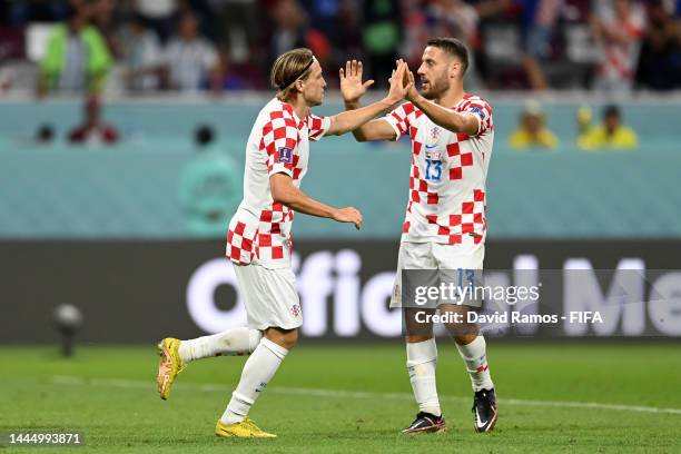 Lovro Majer of Croatia celebrates with Nikola Vlasic after scoring their team's fourth goal during the FIFA World Cup Qatar 2022 Group F match...