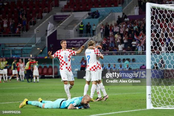 Lovro Majer of Croatia celebrates with teammates after scoring their team's fourth goal during the FIFA World Cup Qatar 2022 Group F match between...