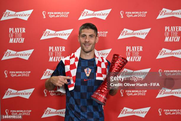 Andrej Kramaric of Croatia poses with the Budweiser Player of the Match Trophy following to the FIFA World Cup Qatar 2022 Group F match between...