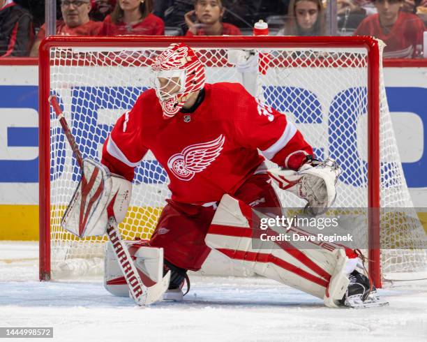 Ville Husso of the Detroit Red Wings reacts to a shot against the Nashville Predators during the second period of an NHL game at Little Caesars Arena...