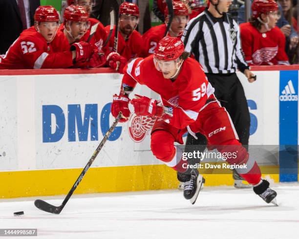 Tyler Bertuzzi of the Detroit Red Wings skates up ice with the puck against the Nashville Predators during the third period of an NHL game at Little...