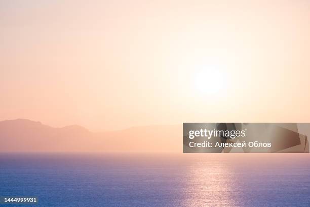 summer scenery on the mediterranean coast in turkey near marmaris and icmeler. just after dawn. a soft focus view of mountains in morning haze and blue water on mediterranean sea - blush pink background stock pictures, royalty-free photos & images