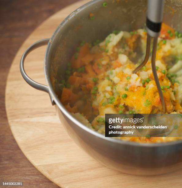 belgian stoemp preparation - potato masher stockfoto's en -beelden
