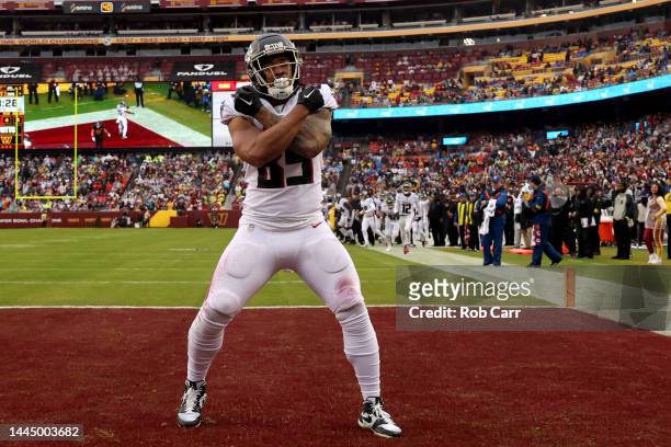 MyCole Pruitt of the Atlanta Falcons celebrates after catching a second quarter touchdown against the Washington Commanders at FedExField on November...