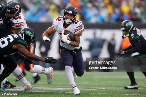 David Montgomery of the Chicago Bears runs for yards in the first half of a game against the New York Jets at MetLife Stadium on November 27, 2022 in...