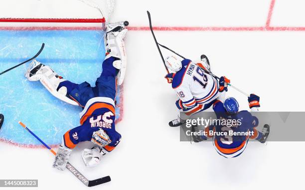 Ilya Sorokin of the New York Islanders blocks the net against Zach Hyman of the Edmonton Oilers at the UBS Arena on November 23, 2022 in Elmont, New...