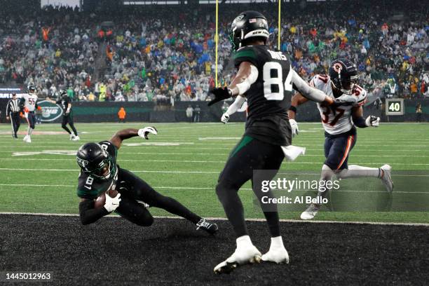 Elijah Moore of the New York Jets scores a touchdown in the third quarter of a game against the Chicago Bears at MetLife Stadium on November 27, 2022...