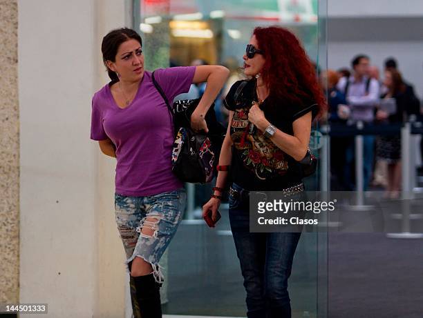 Celia Lora and Chela Lora walk in the terminal 2 of the international airport Benito Juarez on May 11, 2012 Mexico City, Mexico.