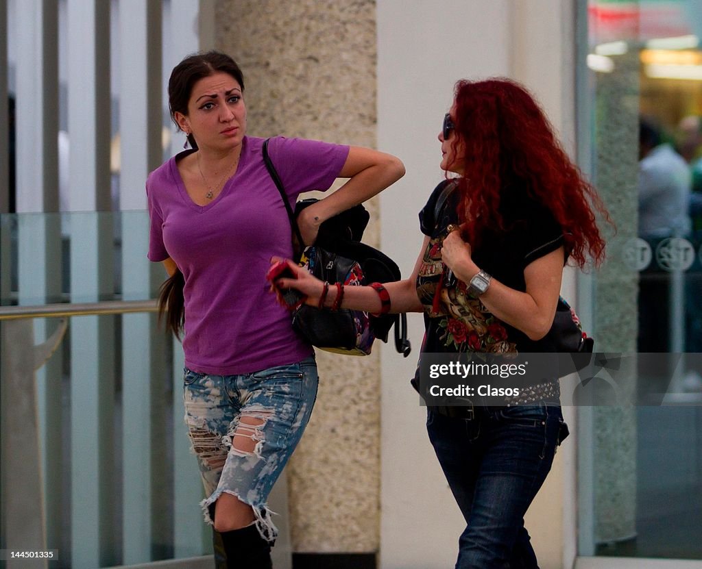 Chelsea Loria Celia Lora and Chela Lora walk in the terminal 2 of the international ...