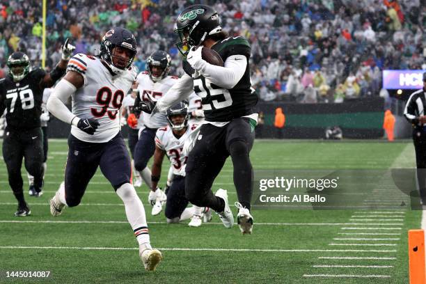 Ty Johnson of the New York Jets scores a touchdown in the third quarter of a game against the Chicago Bears at MetLife Stadium on November 27, 2022...