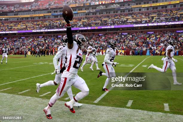Mike Ford of the Atlanta Falcons celebrates after intercepting a pass during the third quarter of a game against the Washington Commanders at...