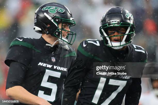 Mike White of the New York Jets and Garrett Wilson of the New York Jets celebrate after a touchdown in the second half of a game against the Chicago...