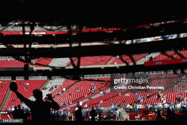 Defensive end J.J. Watt of the Arizona Cardinals warms up before the NFL game against the Los Angeles Chargers at State Farm Stadium on November 27,...