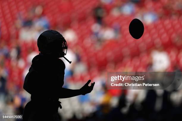 Running back Corey Clement of the Arizona Cardinals warms up before the NFL game against the Los Angeles Chargers at State Farm Stadium on November...