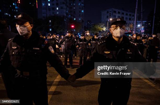 Police form a cordon during a protest against Chinas strict zero COVID measures on November 27, 2022 in Beijing, China. Protesters took to the...