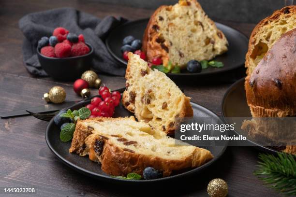 traditional italian christmas cake panettone with raisins and candied fruits, fruit bread. holiday food for christmas and new year - panettone stock-fotos und bilder
