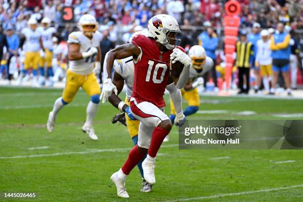 DeAndre Hopkins of the Arizona Cardinals runs with a touchdown pass in the first quarter of a game against the Los Angeles Chargers at State Farm...