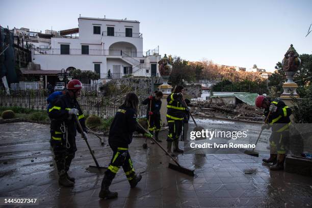 Volunteers clean up the mud after the landslide that hit Casamicciol on November 27, 2022 in Casamicciola Terme, Italy. Italian rescuers continue...