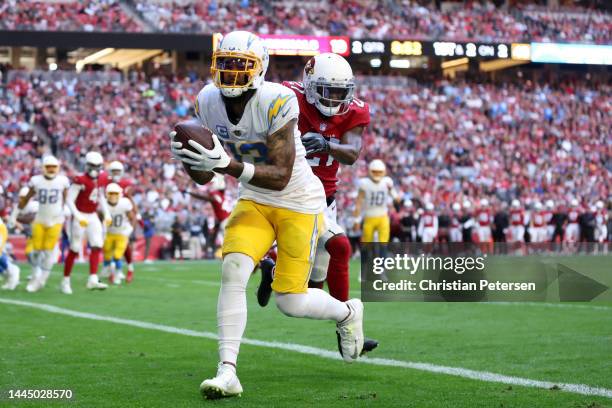 Keenan Allen of the Los Angeles Chargers scores a touchdown in the second quarter of a game against the Arizona Cardinals at State Farm Stadium on...