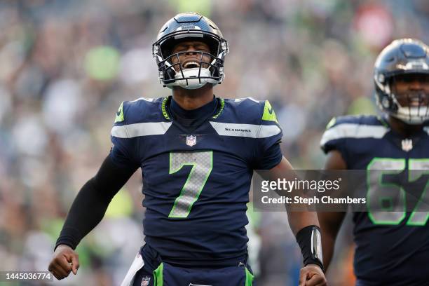 Geno Smith of the Seattle Seahawks celebrates a touchdown during the third quarter in the game against the Las Vegas Raiders at Lumen Field on...