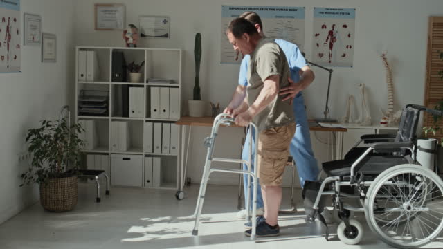 Doctor Caring About Patient during Rehabilitation