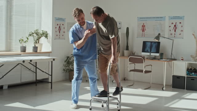 Doctor Helping Patient to Stand on the Step