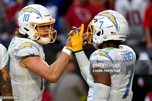 Justin Herbert and Gerald Everett of the Los Angeles Chargers react in the second half of a game against the Arizona Cardinals at State Farm Stadium...