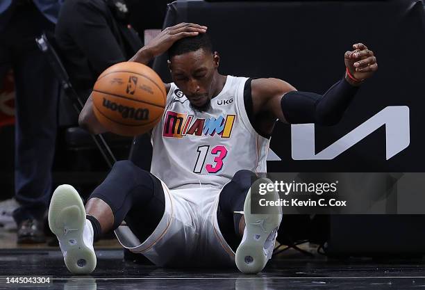 Bam Adebayo of the Miami Heat reacts after dunking against John Collins of the Atlanta Hawks during the second half at State Farm Arena on November...