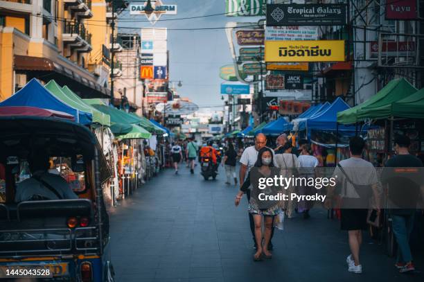 crowds and businesses on khao san road in bangkok, thailand - khao san road stock pictures, royalty-free photos & images