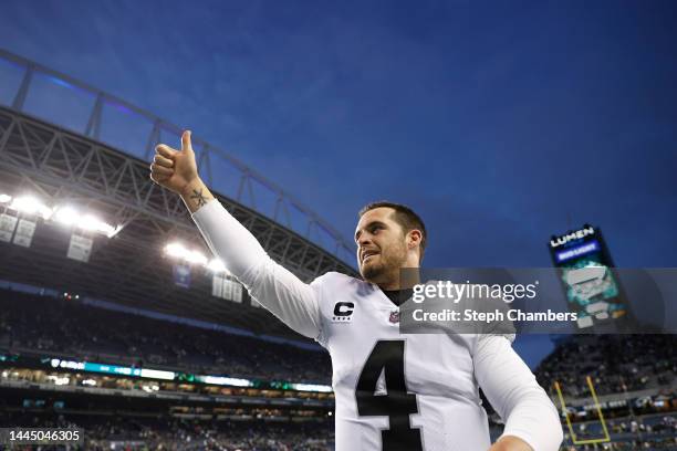 Derek Carr of the Las Vegas Raiders celebrates after beating the Seattle Seahawks 40-34 in overtime at Lumen Field on November 27, 2022 in Seattle,...