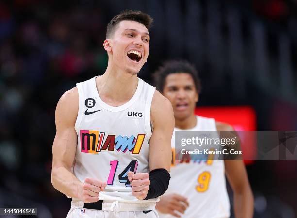 Tyler Herro of the Miami Heat reacts after a three-point basket by Dru Smith against the Atlanta Hawks during the second half at State Farm Arena on...