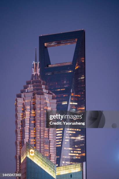 modern office building at twilight,shanghai,china - world financial centre stock pictures, royalty-free photos & images