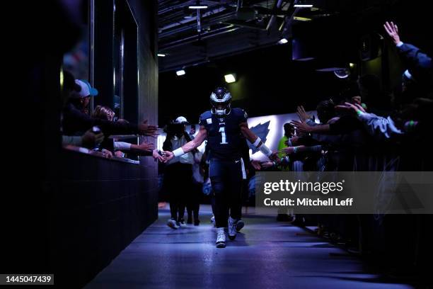 Jalen Hurts of the Philadelphia Eagles high fives fans as he walks to the field before the game against the Green Bay Packers at Lincoln Financial...