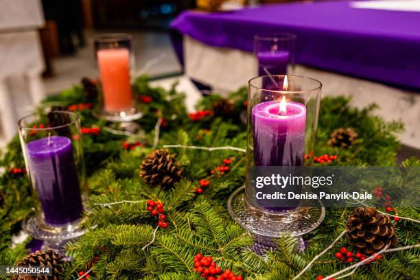 first sunday of advent - advent wreath purple candles stock pictures, royalty-free photos & images