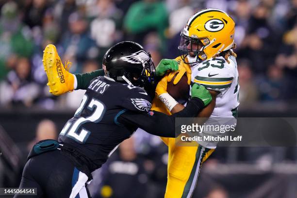 Aaron Jones of the Green Bay Packers scores a 23-yard receiving touchdown as he is defended by Marcus Epps of the Philadelphia Eagles during the...