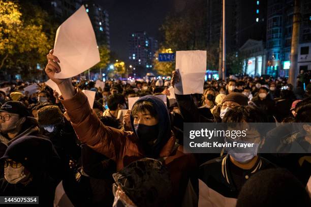 Protesters hold up pieces of paper against censorship and China's strict zero COVID measures on November 27, 2022 in Beijing, China. Protesters took...