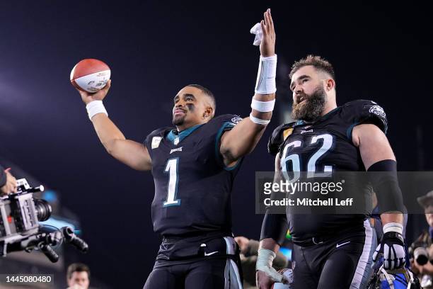 Jalen Hurts and Jason Kelce of the Philadelphia Eagles walk off the field after defeating the Green Bay Packers 40-33 at Lincoln Financial Field on...