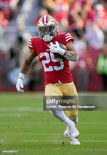 Elijah Mitchell of the San Francisco 49ers carries the ball against the New Orleans Saints during the second quarter of an NFL football game at...