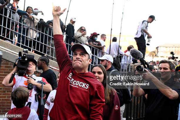 Head coach Shane Beamer of the South Carolina Gamecocks celebrates after defeating the Clemson Tigers at Memorial Stadium on November 26, 2022 in...