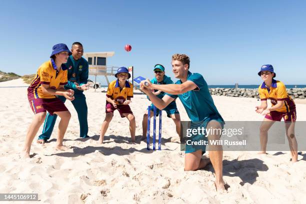 Usman Khawaja, David Warner, Cameron Green of Australia and kids from Subiaco Floreat Cricket Club take part in a beach cricket launch at City Beach...