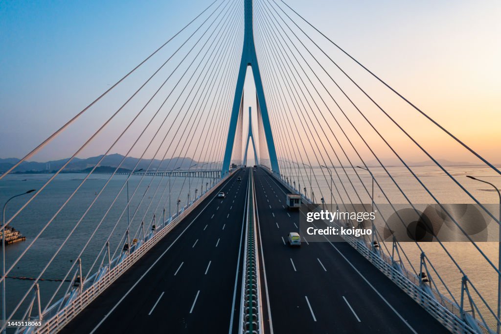 Aerial photography of cross-sea highway at sunset