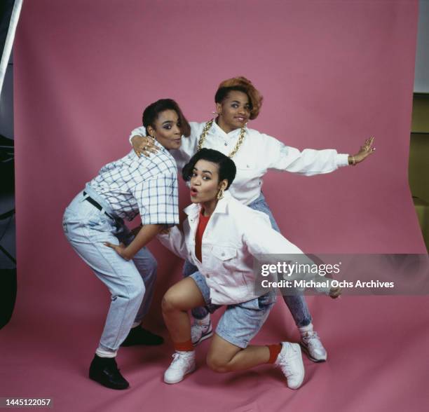 American hip hop band Salt-N-Pepa , with both Salt and Pepa wearing white jackets and stonewashed denim, and Spinderella wearing stonewashed denim...