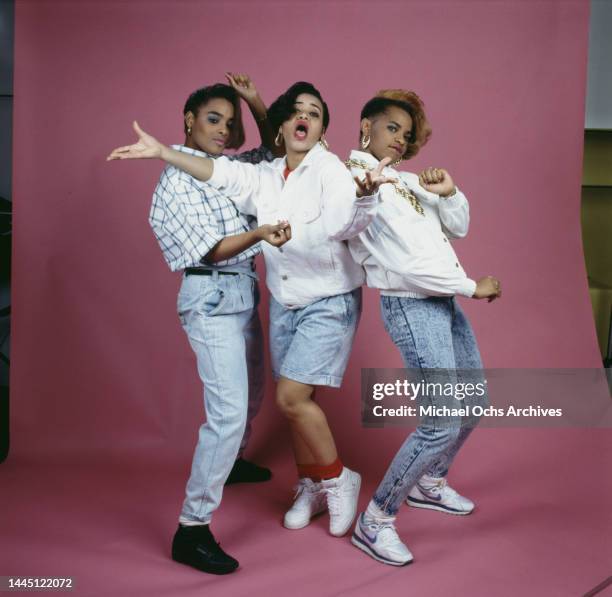 American hip hop band Salt-N-Pepa , with both Salt and Pepa wearing white jackets and stonewashed denim, and Spinderella wearing stonewashed denim...