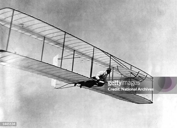 Orville Wright flies a glider in Kitty Hawk, NC in 1902.