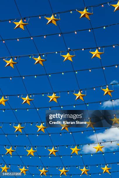 hanging stars with sky background - arts centre melbourne foto e immagini stock