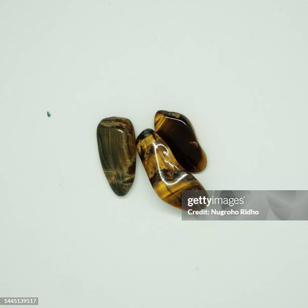 tiger's eye crystal gems - tiger eye stock pictures, royalty-free photos & images
